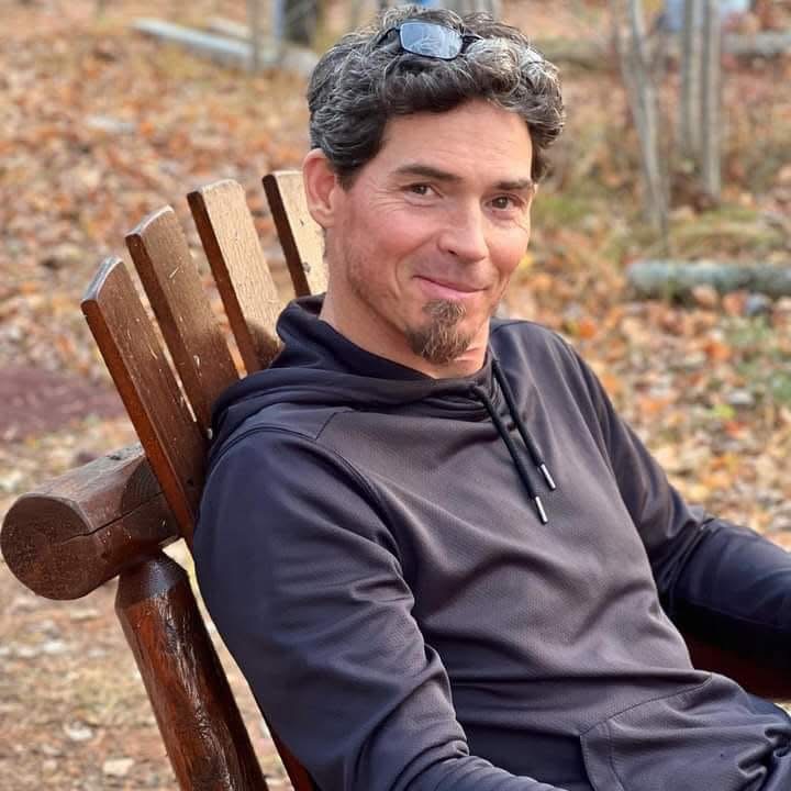 Professional painter carefully cutting in around window frame - St. Louis Park painting services